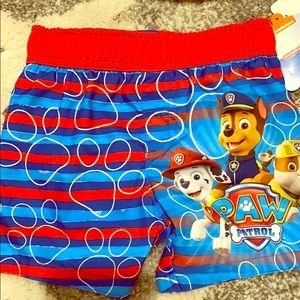 Boys swim trunks and sun hat